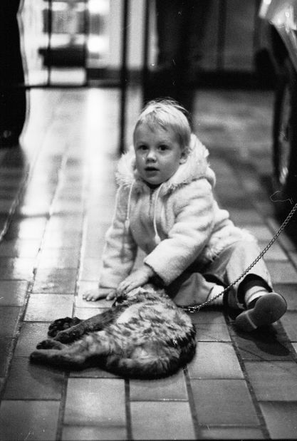 Child with cougar cub, 1979